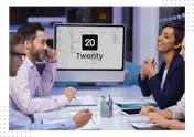 A team in a meeting around a monitor showing Twenty CRM