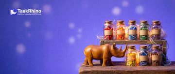 A small wooden rhino stands before a short wooden shelf of seven small, different glass jars, each holding differently shaped coloured tiles, nudging one jar forward with its horn.