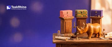 A small wooden rhino stands in front of three small wooden pedestals in a row, each holding a different tiny tool chest (one coral, one of green and amber tiles, one violet), weighing them up.