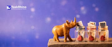 A small wooden rhino chooses one of a row of small glass jars, each holding a tiny heart-shaped token and a few paper cards.