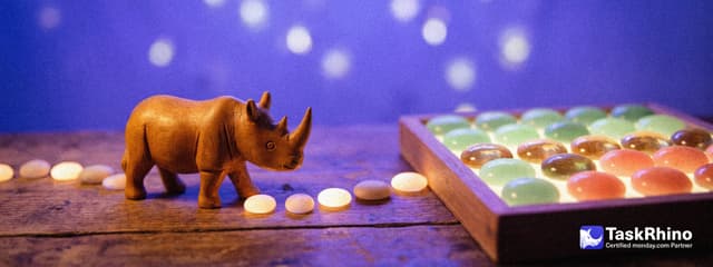 A small wooden rhino follows a winding path of glowing stepping stones towards a tidy board of colored tiles.