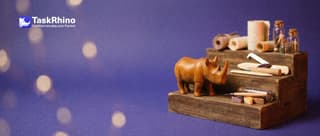 A small wooden rhino stands on the middle of three wooden steps of rising height, each step holding a bigger set of small paper form tools.
