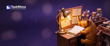 A small wooden rhino sits alone at a tiny wooden desk under a small glowing desk lamp, with one neat notebook and a few index cards pinned up.