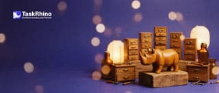 A small wooden rhino stands before ten little tool chests arranged by height on wooden blocks, like a podium.