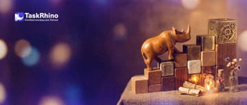 A small wooden rhino climbs a staircase of ten wooden blocks that grows from a small plain block at the bottom to a large complex brass block at the top.