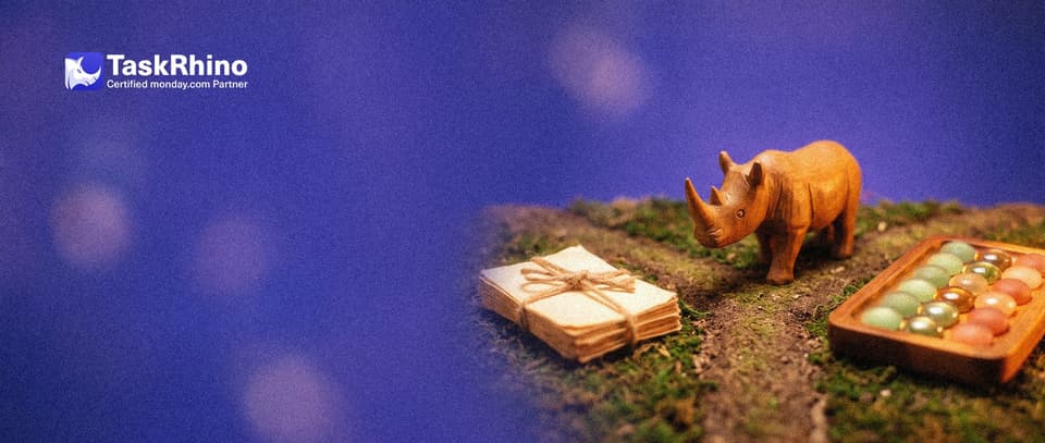A small wooden rhino stands where a narrow garden path forks: one way leads to a stack of paper task cards, the other to a tidy board of coloured tiles.