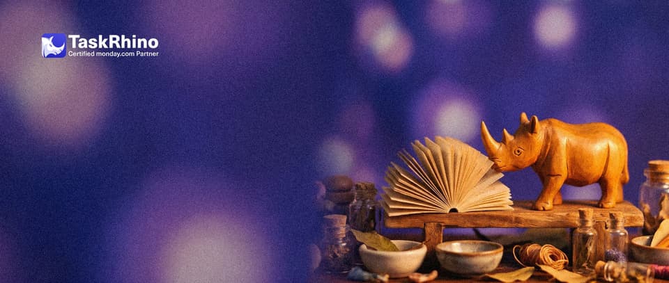 A small wooden rhino turns a page with its horn in a small booklet of paper form pages fanned open on a wooden stand.
