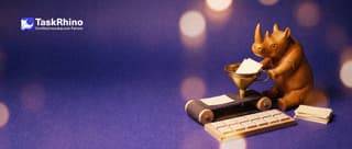 A small wooden rhino operates a small brass funnel that feeds paper request cards onto a conveyor which sorts them into a tidy tile board.