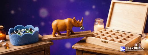 A small wooden rhino carries beads from a cloud-shaped basket into a fresh wooden case, nothing dropped on the way.