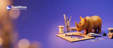 A small wooden rhino mends a cracked wooden stencil with a tiny tube of glue and paper clips.
