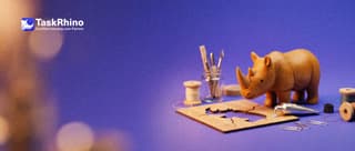 A small wooden rhino mends a cracked wooden stencil with a tiny tube of glue and paper clips.