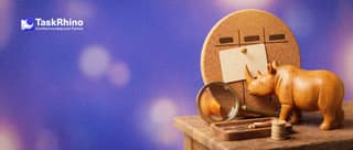A small wooden rhino pins an index card into one of three columns on a little cork board, a brass magnifying glass leaning beside it.