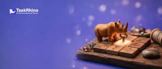 A small wooden rhino slots a paper form card like a key into an existing tile on a board, which lights up.