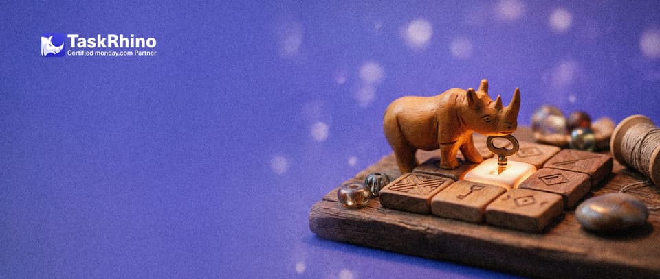 A small wooden rhino slots a paper form card like a key into an existing tile on a board, which lights up.