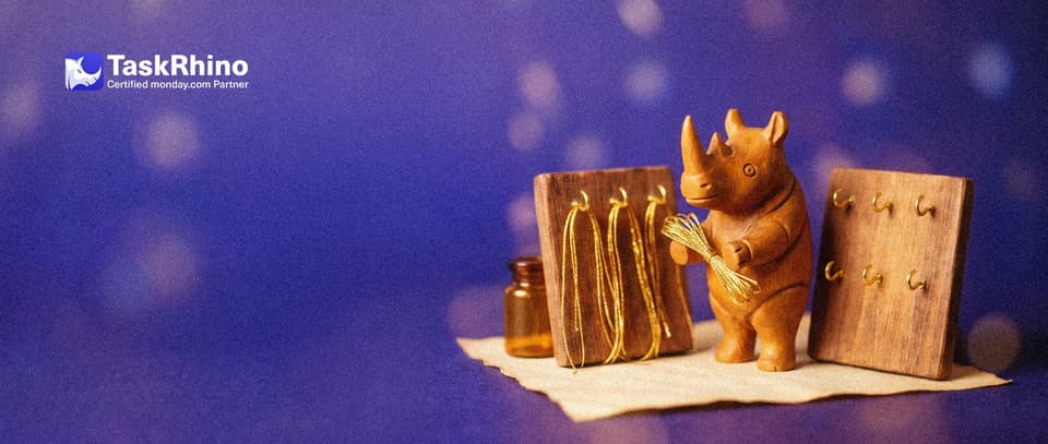 A small wooden rhino holds a bundle of golden threads: the original board has small brass hooks holding them, the copy board beside it has empty hooks.